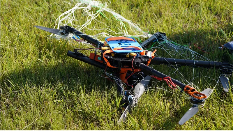 A drone brought down after being engulfed by netting shot by the drone hunter.