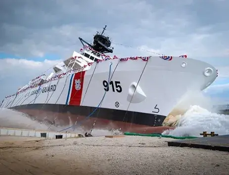 U.S. Coast Guard ship moving from shoreline.