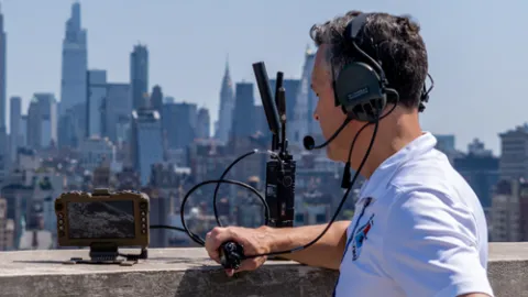 Engineer testing device on urban rooftop
