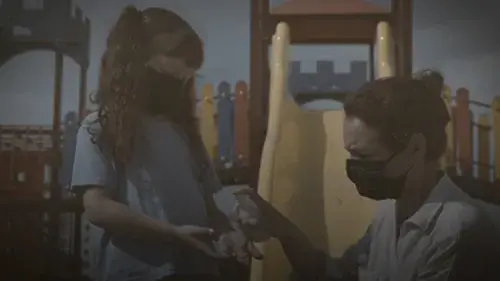 Masked Parent Assisting masked child