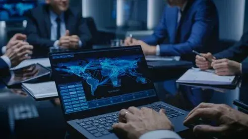 Computer displaying network over world map