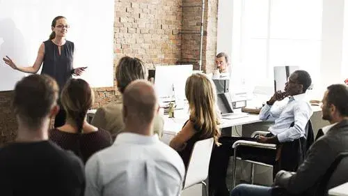 Teacher at the front of a business classroom