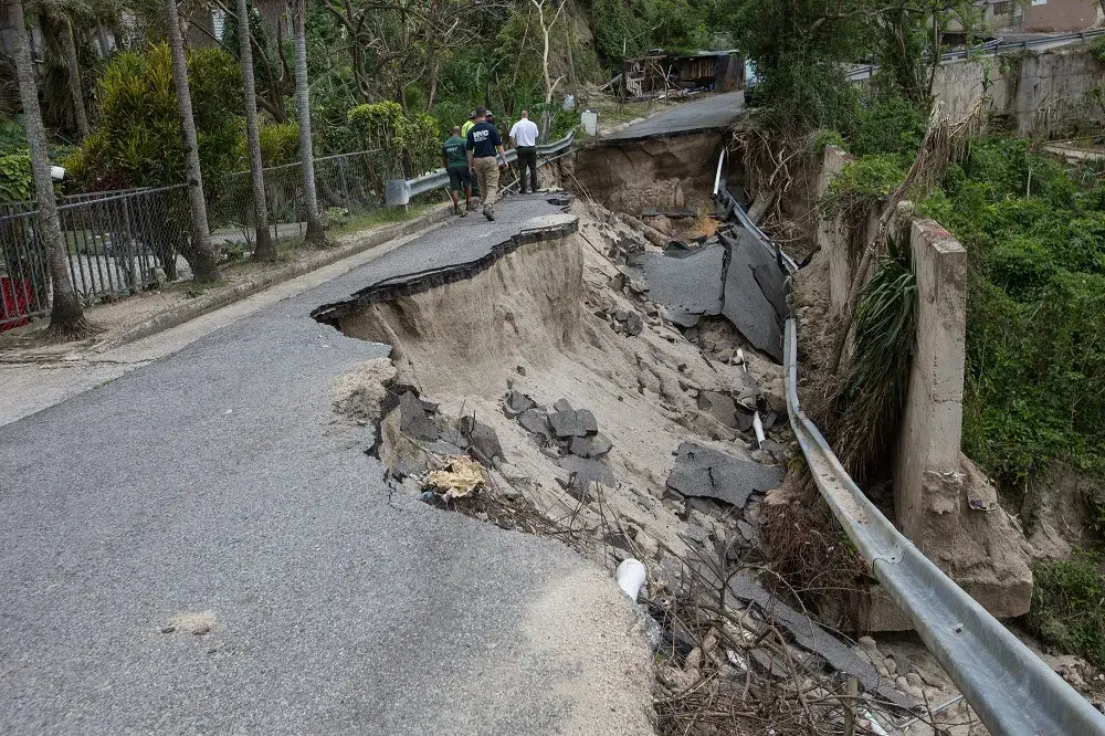 Department of Sanitation New York (DSNY) Debris Management Specialists assess road and bridge accessibility in the Jayuya municipality
